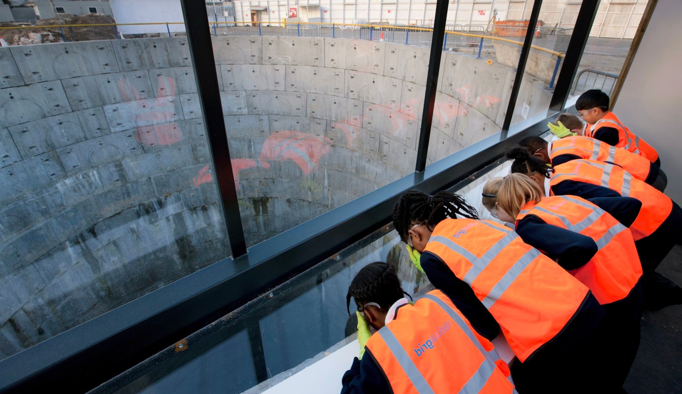 School pupils in PPE look into one of the LPT tunnel shafts