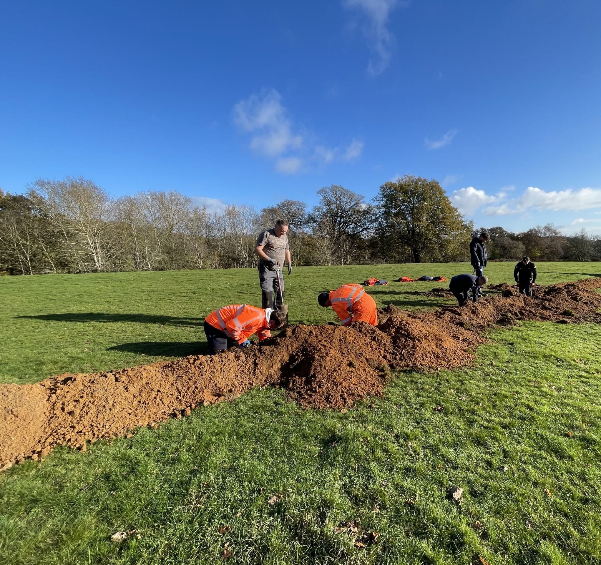 Project volunteers working in a field