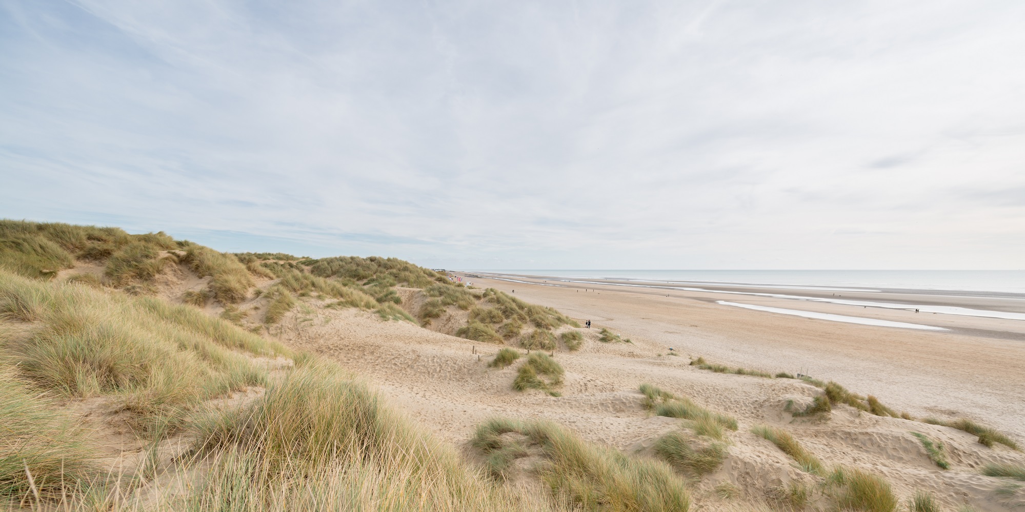 View over beach sand dunes into ocean