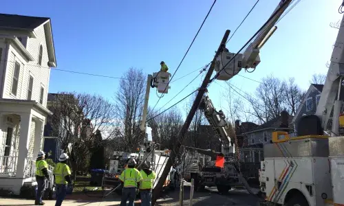 National Grid operatives restore a pole taken down in Storm Riley
