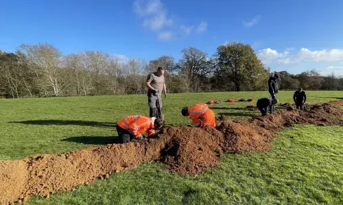 Project volunteers working in a field