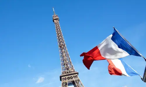 Eiffel Tower with french flag for National Grid Paris Agreement article