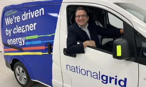 Graeme Cooper sitting in new National Grid ENV-200 electric van