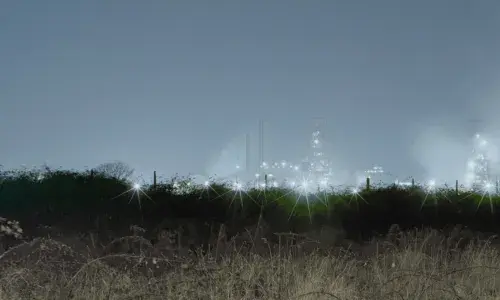 Lights from Steelworks in the distance at night