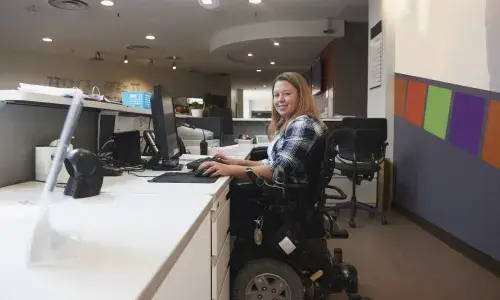 Young woman in wheelchair for National Grid article on disability