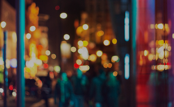 A blurred but well-lit cityscape