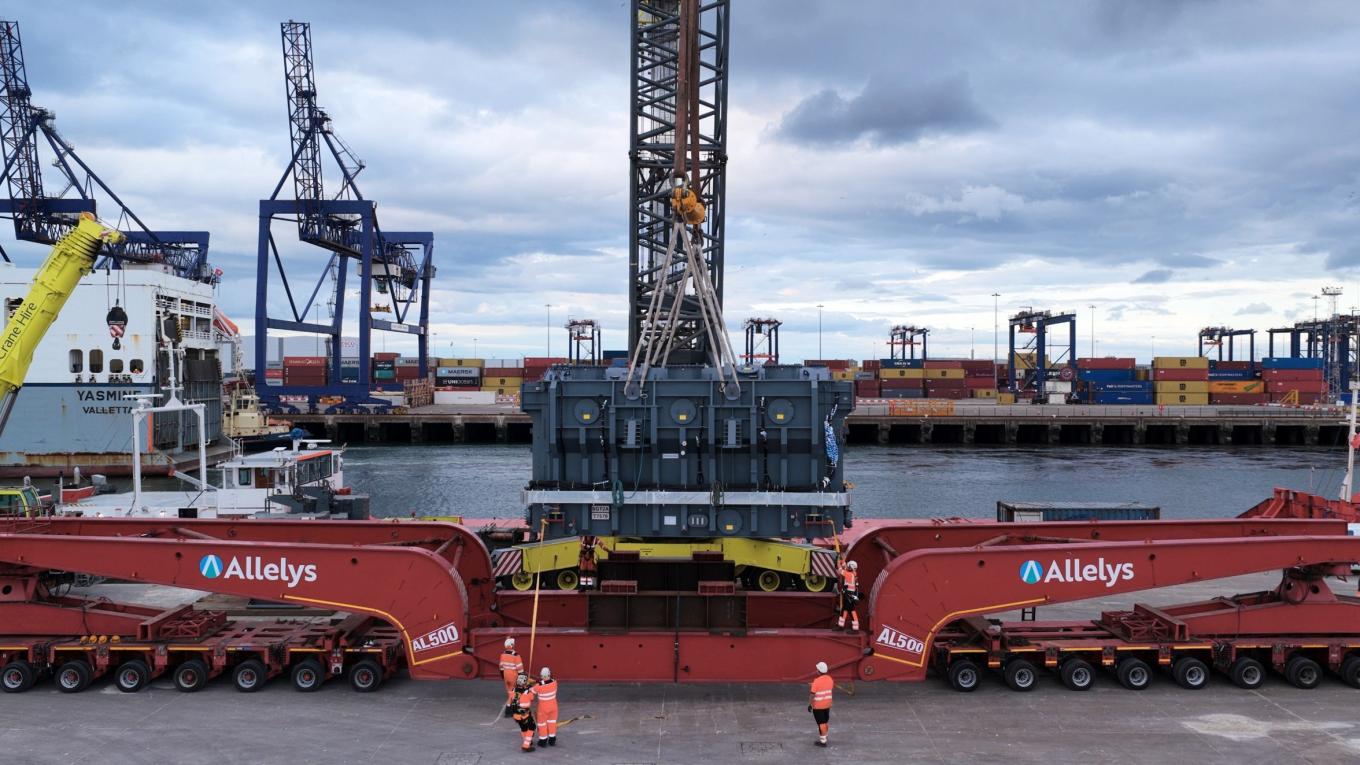 Image of supergrid transformer loading from the docks to a delivery vehicle.