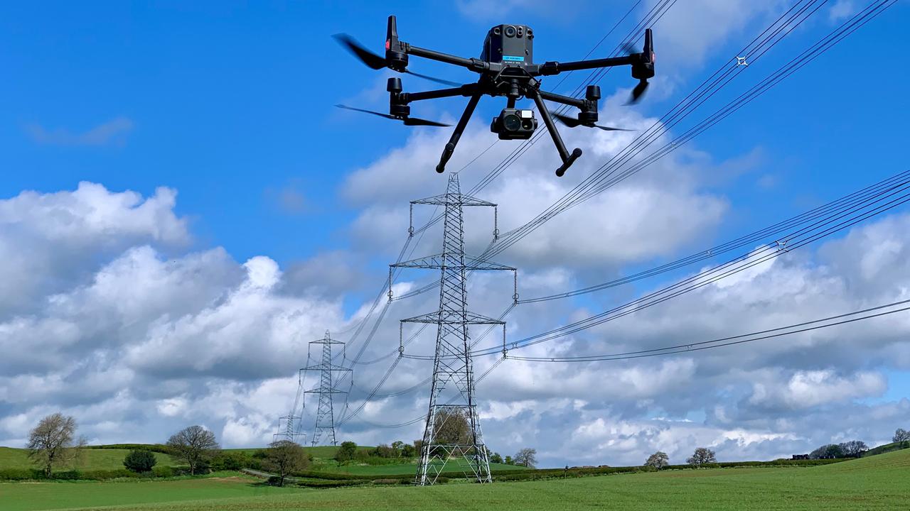 M300_4VC_Drone_1280x720.jpg Drone inspecting high-voltage overhead power lines