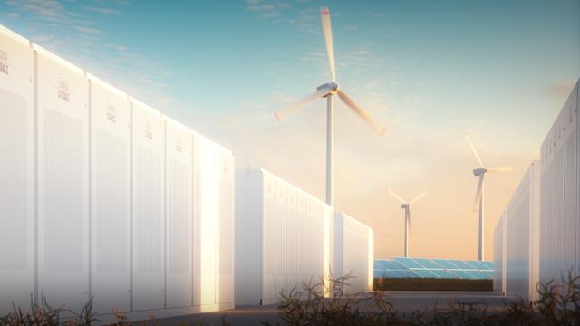 EnergyStorage_WindSolar_640x360.jpg Rows of renewable energy storage batteries with wind turbines and solar panels in the background